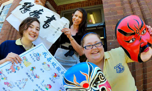 China's fine: Coffs Harbour High School students Jules Kidston, left, and Stephanie Hoad with specialist Chinese teacher Jane Wilson. China's fine: Coffs Harbour High School students Jules Kidston, left, and Stephanie Hoad with specialist Chinese teacher Jane Wilson.